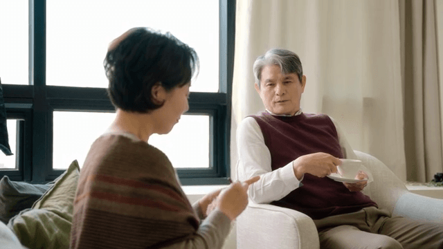 Elderly couple relaxing in a cozy living room