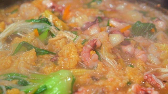 Seafood Scorched Rice Soup Cooked in a Hot Pan