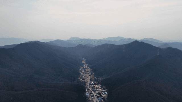 Aerial view of a mountain valley with a village