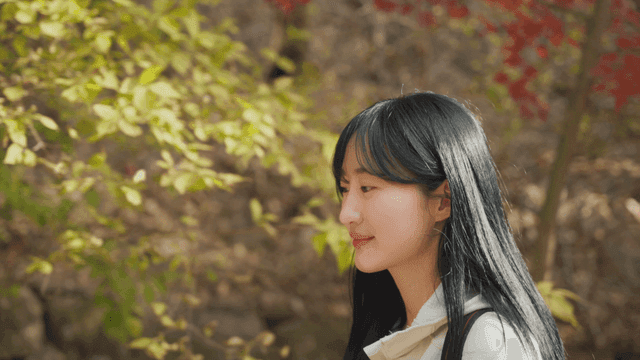 Woman hiking through autumn foliage