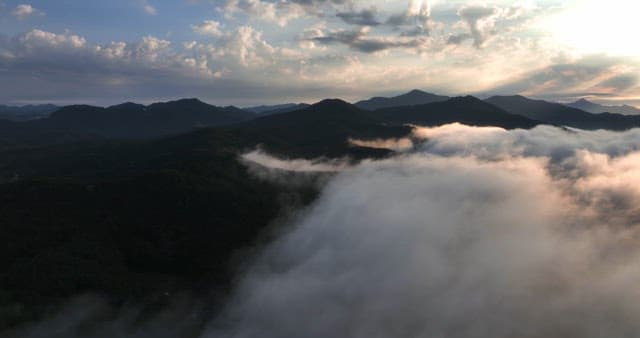 Mountains with clouds at sunrise