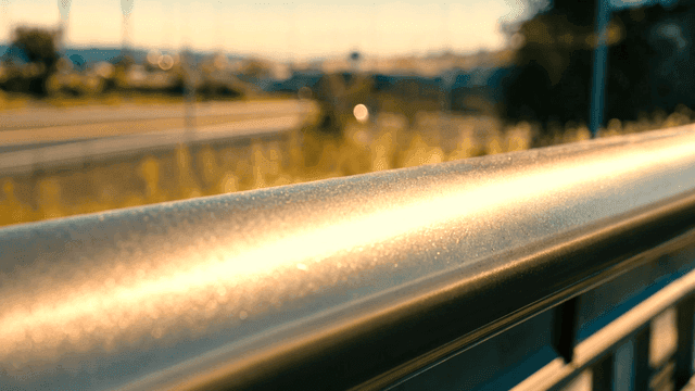 Iron railings shining in hot sunlight