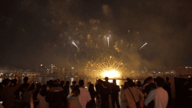 Fireworks display over a city skyline