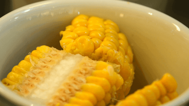 Yellow corn in white bowl