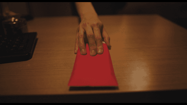 Woman handing red envelope