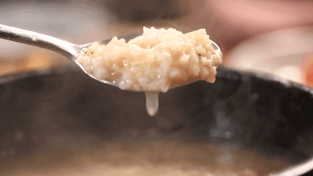 Spoonful of steaming rice water