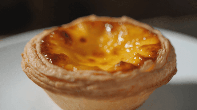 Delicious egg tart on white plate