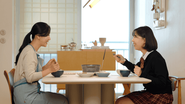 Mother and daughter enjoying a meal together
