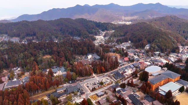 Scenic view of a town surrounded by mountains