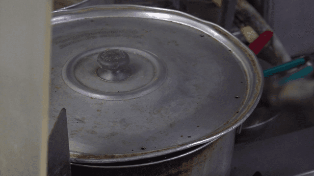 Pot with a lid in a kitchen setting