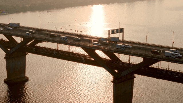 Bridge with vehicles during sunset