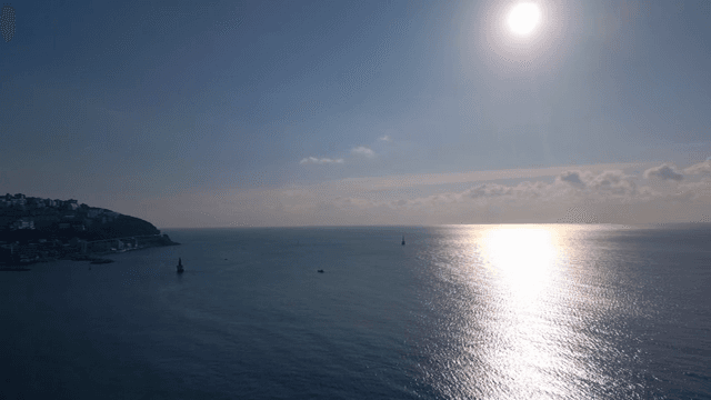 Serene ocean view with the sun shining