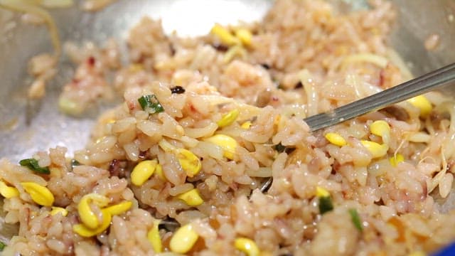 Spoonful of grilled webfoot octopus on bean sprout rice