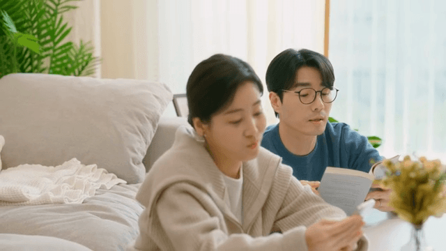 Couple reading and using a smartphone