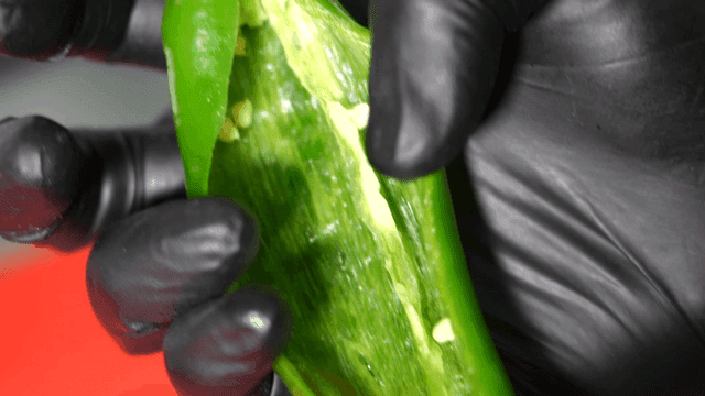 Close-up of a green pepper being held