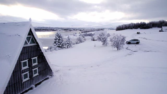 Snow-covered landscape with a frozen lake