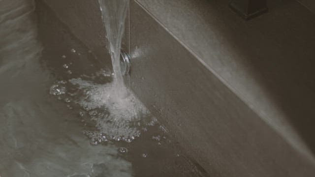 Serene Water Flowing from a Faucet