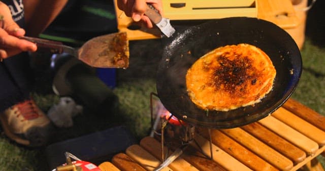 Preparing Savory Korean pancake on a Hot Skillet