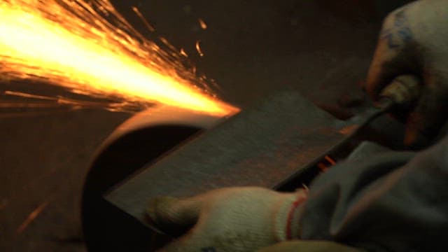 Sparks flying from a grinding wheel