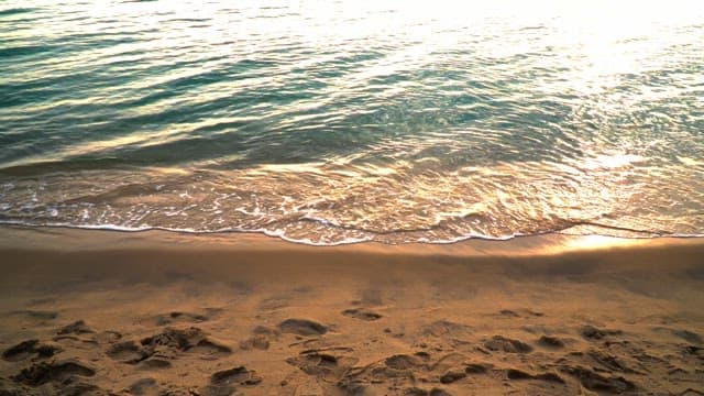 Waves gently lapping on a sandy beach