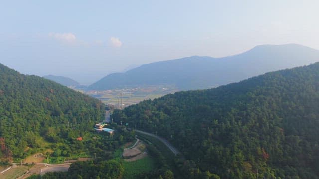 Scenic view of mountains and farmland