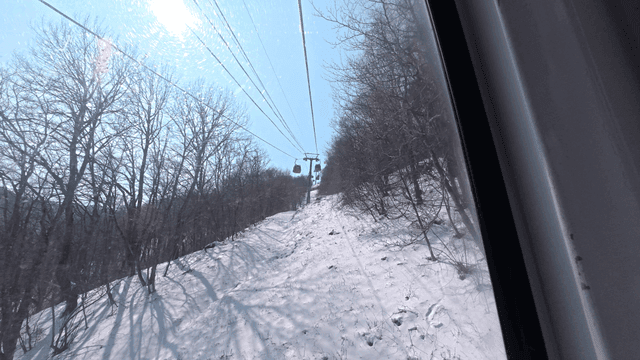 Snowy mountain view from a cable car