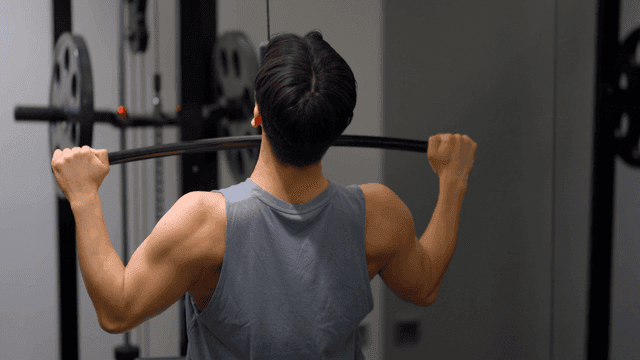 Man doing lat pulldown workout in gym
