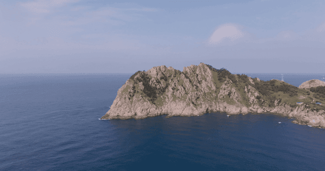 A rocky island surrounded by the sea