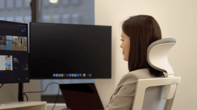Working woman sitting at desk in office