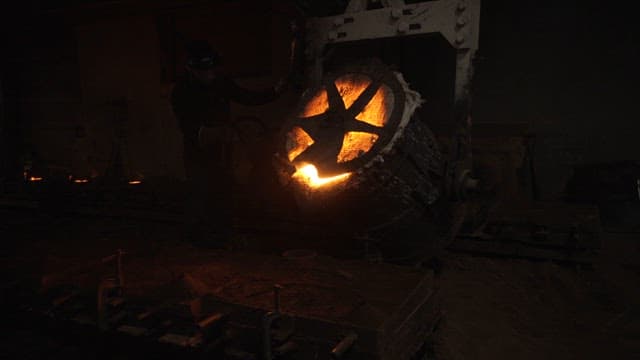 Molten metal being poured in a foundry