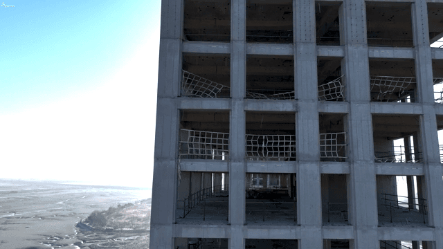 Unfinished building near a coastal area