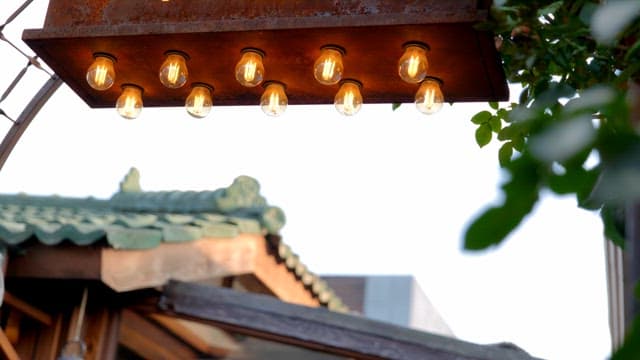 Light bulb lighting with the hanok roof in the background