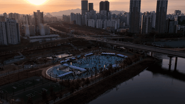 City skyline and sunset, sports field