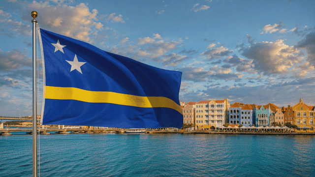 Curaçao flag and colorful buildings on seaside