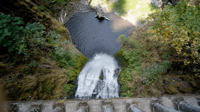 A serene waterfall cascading down a cliff