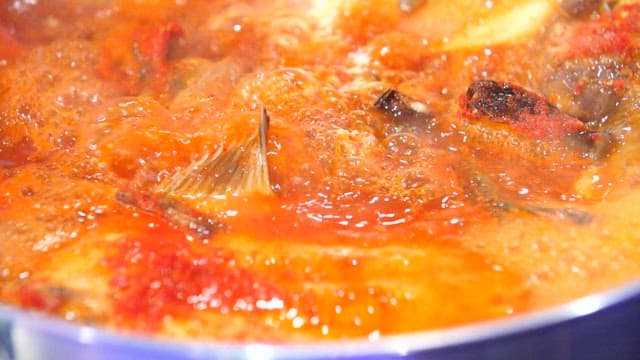 Steamed fish containing various fish simmering in a pot