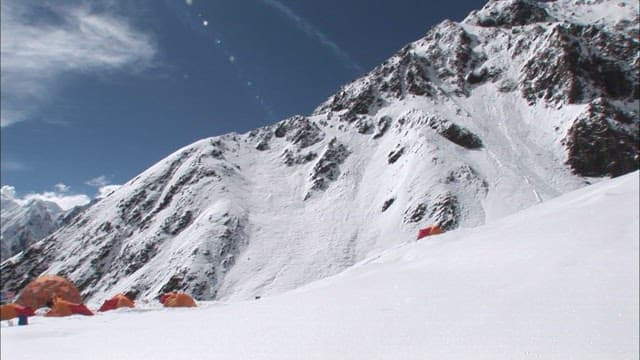 Snow-covered campsite in Spantik Gold Peak