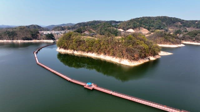 Scenic lake with a winding walkway