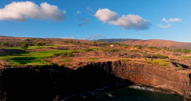 Aerial View of a Coastal Golf Course at Sunset