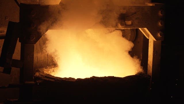 Molten metal being poured in a foundry