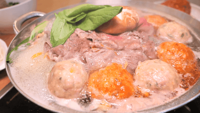 Rolled dumpling hot pot with various ingredients