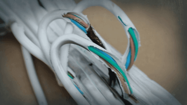 Damaged electrical cables on a surface