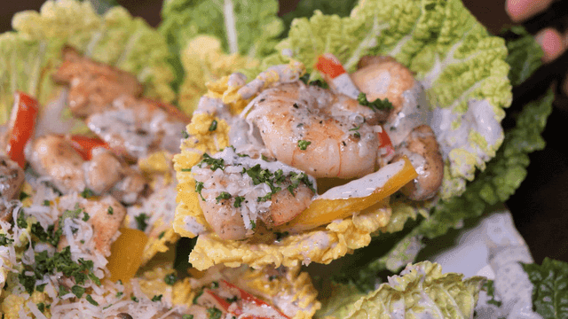 Shrimp salad with sauce on cabbage leaves