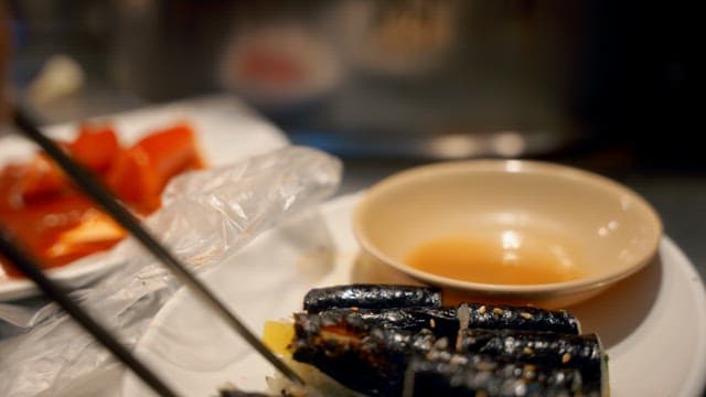 Gimbap and tteokbokki on a plate