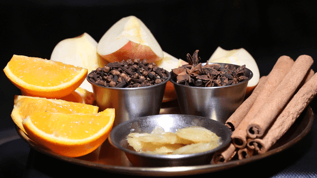Aromatic spices and fresh fruits on a tray