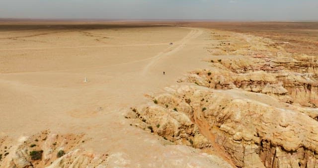 Vast desert landscape with rocky formations