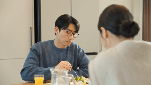 Couple enjoying a meal together at home