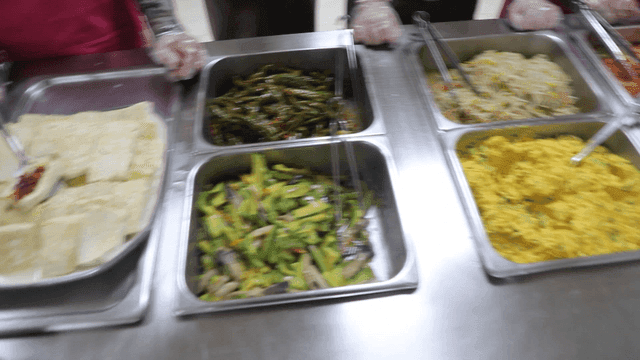 Various Korean dishes placed on serving table