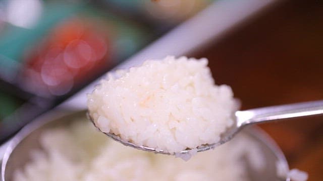 Spoonful of rice with salted clam