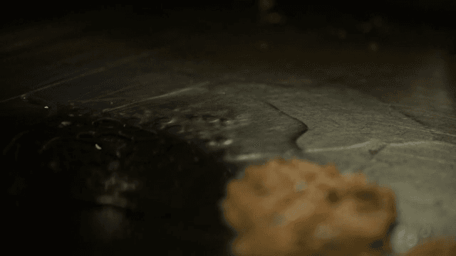 Oil being poured onto a hot griddle